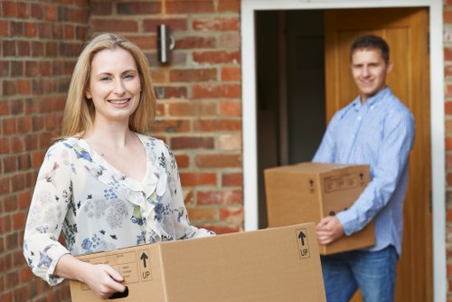 Professional packers organizing boxes in a Fulham storage facility