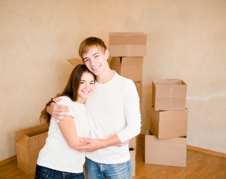Unpackers setting up furniture in a new Fulham home